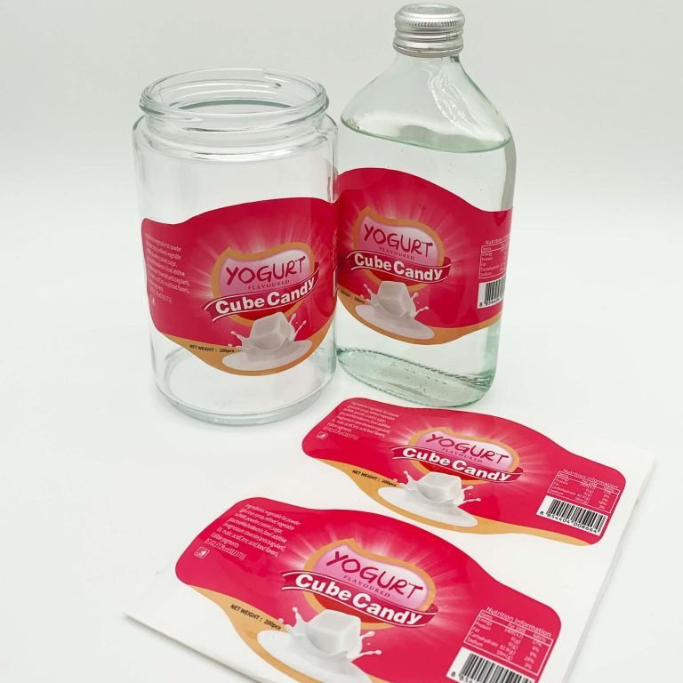 Red product labels applied to glass bottles and jars